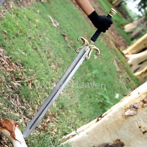 Fully handmade He-Man Power Sword replica with a carbon steel blade, solid brass guard and pommel, inspired by the Masters of the Universe movie. High-quality fantasy sword perfect for cosplay, display, or as a collectible gift for fans of classic 80s heroes.