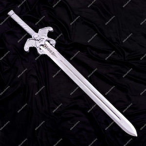May include: A silver-colored sword with a detailed hilt featuring wings and a skull design. The blade is long and straight, with a pointed tip. The sword is displayed against a black background.
