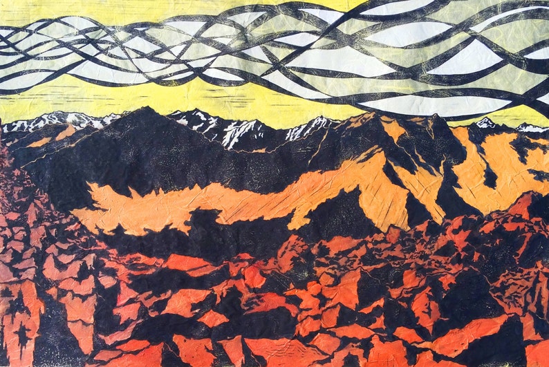 May include: An abstract landscape print featuring a mountain range with snow-capped peaks. The artwork uses a palette of orange, black, and yellow, with a textured appearance. The sky has a unique pattern of black and white lines.