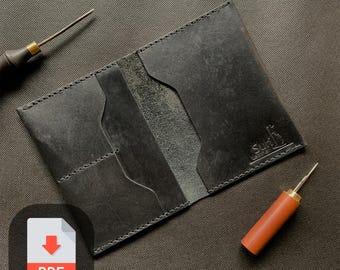 May include: A black leather wallet with multiple card slots and a stitched design. The wallet has the word "Surib" embossed on the front.
