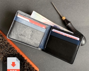 May include: Open black leather wallet with blue accents, holding cards and cash. The wallet has the "Suri Leather" logo embossed on the front. A leather working tool and a brush are next to the wallet.