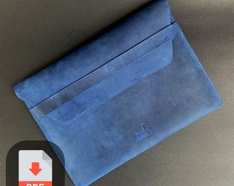 May include: A blue leather laptop sleeve with a flap closure and a small pocket on the front. The sleeve has a logo that says "Surf" with a stylized image of a surfer.