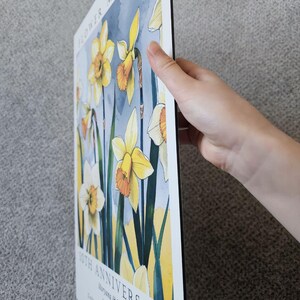 Personalized aluminum anniversary print featuring daffodils, created as a tin anniversary gift for a couple celebrating their 10 year wedding anniversary