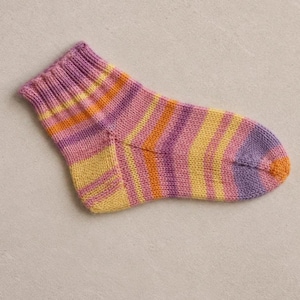 May include: A single, colorful knitted sock. The sock features stripes of pink, yellow, orange, and purple. The cuff is a darker shade of pink. The sock is designed for comfort and warmth.