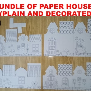 May include: A bundle of paper houses featuring plain and decorated designs. The white paper cutouts display black line art illustrations of doors, windows, flowers, sheep, bees, birds, cats, and dogs, along with roof patterns like shingles and zigzags.