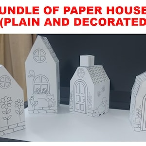 May include: A bundle of four white paper houses with black line art illustrations. The text BUNDLE OF PAPER HOUSES (PLAIN AND DECORATED) appears above the houses. Each house features distinct drawings of flowers, animals, doors, and windows.