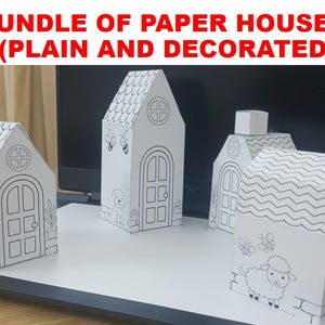May include: A bundle of four white paper houses with black line art illustrations. The houses feature various designs including arched doors, windows, roof shingles, bees, a dog, and a sheep. The text BUNDLE OF PAPER HOUSES (PLAIN AND DECORATED) is visible.