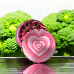Pink heart-themed 4-piece herb grinder with pollen catcher and scraper, perfect cute grinder for women, stylish gift for her