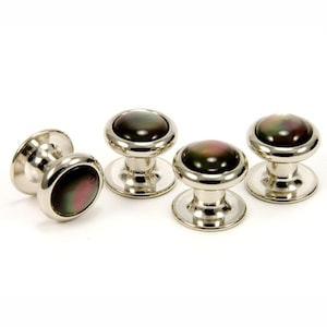 May include: Set of four silver cufflinks with black and iridescent mother of pearl insets.