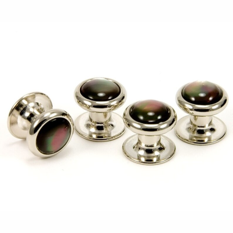 May include: Set of four silver cufflinks with black and iridescent mother of pearl insets.