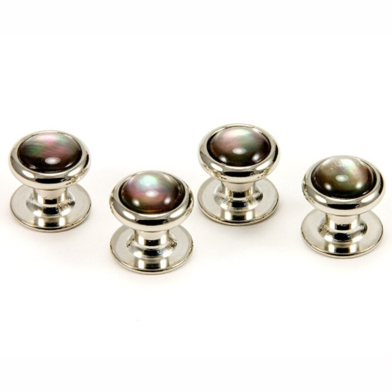 May include: Set of four silver cufflinks with black and iridescent mother of pearl insets.