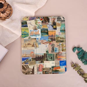 May include: A rectangular travel-themed tablet case featuring a collage of vintage postcards, stamps, and travel-related imagery. The design includes images of landmarks, cities, and travel destinations. The case is a mix of colors, including blues, greens, and browns.