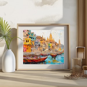 May include: A colorful painting of a cityscape with buildings and boats on a river. The buildings are painted in shades of yellow, orange, blue, and green. The boats are painted in shades of red, blue, and green. The painting is framed in a wooden frame.