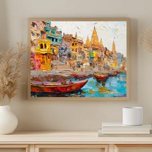 May include: A colorful painting of a cityscape with buildings and boats on a river. The buildings are painted in shades of yellow, orange, red, and blue. The boats are painted in shades of red, orange, and yellow. The river is painted in shades of blue and green.