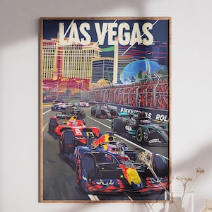 May include: A framed poster featuring a Formula 1 race in Las Vegas. The artwork depicts race cars speeding down a track, with the city skyline in the background. The words "LAS VEGAS" are prominently displayed at the top.
