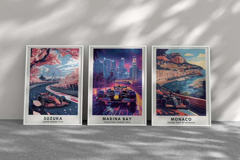May include: Three framed art prints featuring Formula 1 race cars on tracks. The prints showcase Suzuka, Marina Bay, and Monaco, with vibrant colors and detailed illustrations. Each print includes the race location and Grand Prix.