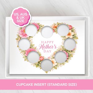 May include: A white cupcake insert with seven circular cutouts, surrounded by a floral heart design with pink and peach flowers. The text "Happy Mother's Day" is centered within the heart. The insert is in a white box, with text that reads "Cupcake Insert (Standard Size)".
