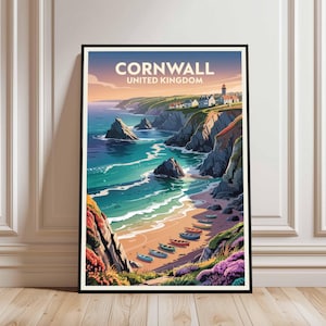 May include: A framed art print featuring a coastal scene of Cornwall, United Kingdom. The artwork depicts a beach with colorful boats, cliffs, and a lighthouse. The text "CORNWALL UNITED KINGDOM" is at the top.