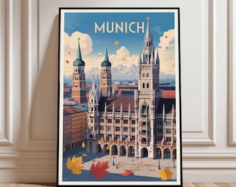 Puede incluir: Una impresión artística enmarcada que presenta una ilustración estilizada de Múnich, Alemania. La obra de arte representa la arquitectura de la ciudad, incluido el Nuevo Ayuntamiento, con la palabra "MUNICH" en la parte superior. Hojas de otoño están dispersas por la escena.