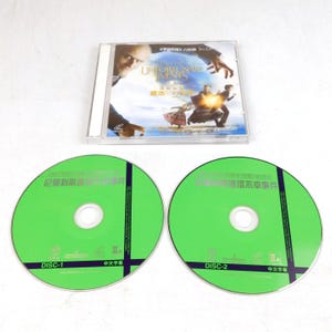 May include: A DVD set featuring "Lemony Snicket's A Series of Unfortunate Events." The set includes a clear plastic case with cover art and two green discs labeled "DISC-1" and "DISC-2." The discs have Chinese text and logos.
