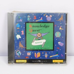 May include: A Knowledge Quest Science CD-ROM in a plastic jewel case. The blue cover features a green central square with an owl illustration, the text "Knowledge Quest Science Ages 15 to Adult," and various icons including a globe, kangaroo, and rocket.