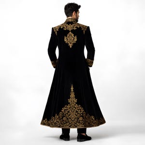 Make a powerful statement with this Victorian-inspired men’s long frock coat, crafted for gothic grooms and formal occasions. This vintage-style overcoat blends royal elegance with modern tailoring, ideal for wedding ceremonies, themed receptions, and luxury prom nights. Designed with premium fabric and sharp detailing, it offers a dramatic silhouette for men who want a bold, aristocratic look.