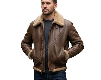 Può includere: Giacca in pelle marrone con colletto e fodera in montone. La giacca ha una chiusura a zip e due tasche anteriori. L'uomo indossa un maglione grigio e jeans blu. Capo di abbigliamento.