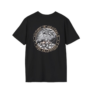 May include: Black t-shirt featuring a circular graphic with a skull pile, a skeleton holding a British flag, and the text "VICTORY IS INEVITABLE" and "RISE AS LEGENDS". The design is in shades of gray and white.