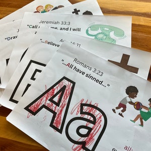May include: A set of printable flashcards with black and white illustrations and bible verses. The flashcards feature a cross, a phone, and a letter A. The text on the flashcards includes verses from Jeremiah 33:3, Romans 3:23, and Acts 16:31.