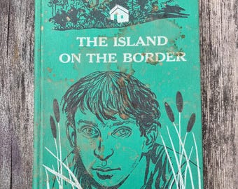 La isla en la frontera: Una historia de la Guerra Civil, de Trella Lamson Dick, 1963. Libro infantil clásico de ficción histórica.