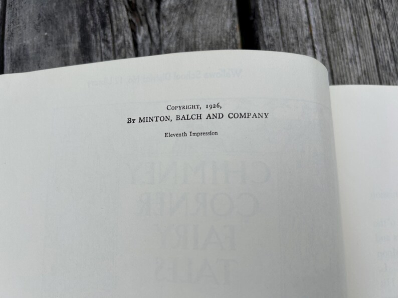May include: The copyright page of a book featuring the text Copyright, 1926, By Minton, Balch and Company, followed by the line Eleventh Impression. The text is printed in black ink on a white paper page with a visible book binding crease.