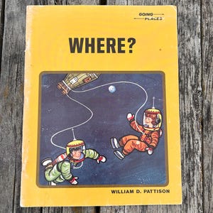 May include: A yellow softcover book titled WHERE? by William D. Pattison, featuring the text GOING PLACES. The cover illustration depicts two figures in space suits floating in a dark blue space scene with a spacecraft and a small planet.