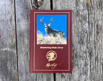 Mastering Mule Deer autorstwa Wayne'a van Zwolla, North American Hunting Club, rocznik 1988.