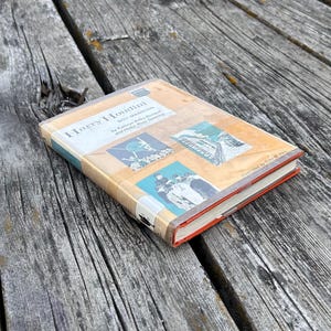May include: A hardcover book titled Harry Houdini: Boy Magician by Kathryn Kilby Borland and Helen Ross Speicher. The cover features a tan background with three illustrations, including a person on a tightrope and a portrait of a young person.