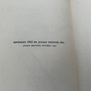 May include: A book page featuring black printed text that reads COPYRIGHT 1942 BY JULIAN MESSNER, INC. and EIGHTH PRINTING, OCTOBER, 1947. The page is off-white with a smooth texture and visible margins on the left and right sides.