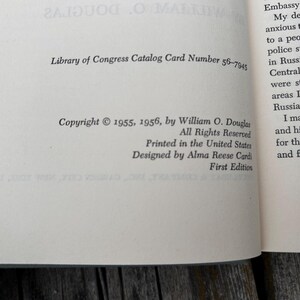 May include: The copyright page of a book featuring black text on a cream-coloured page. It displays the Library of Congress Catalog Card Number 56-7945, copyright 1955, 1956 by William O. Douglas, printed in the United States, and designed by Alma Reese Cardi.