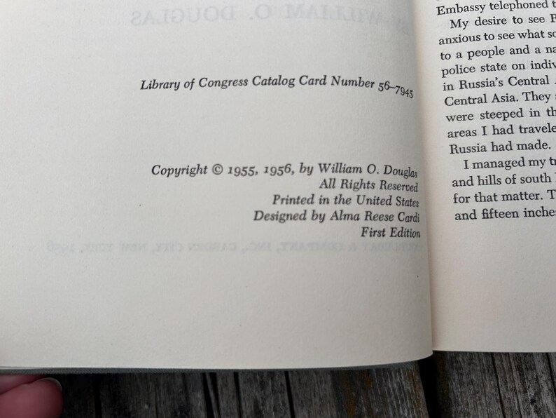 May include: The copyright page of a book featuring black text on a cream-coloured page. It displays the Library of Congress Catalog Card Number 56-7945, copyright 1955, 1956 by William O. Douglas, printed in the United States, and designed by Alma Reese Cardi.