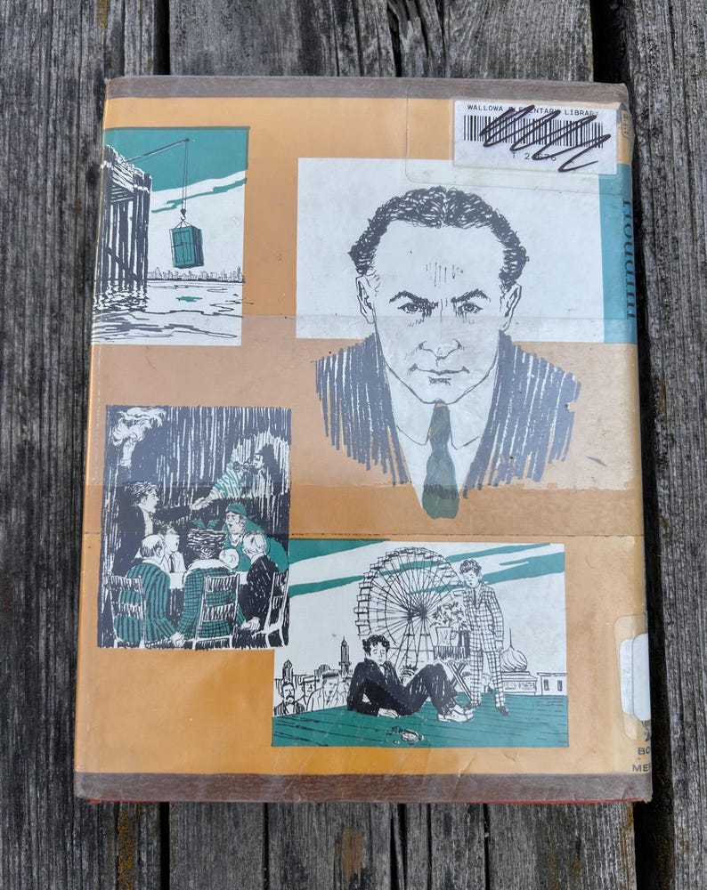 May include: A hardcover book with a tan cover featuring a black and white portrait of a man in a suit and tie, alongside three illustrations depicting a crane lifting a crate, a group of people at a table, and a person near a Ferris wheel.