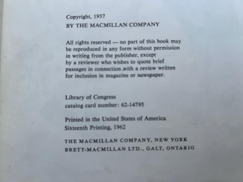 May include: A white book copyright page with black text stating Copyright, 1937 BY THE MACMILLAN COMPANY, All rights reserved, Library of Congress catalog card number 62-14795, Printed in the United States of America, Sixteenth Printing, 1962.