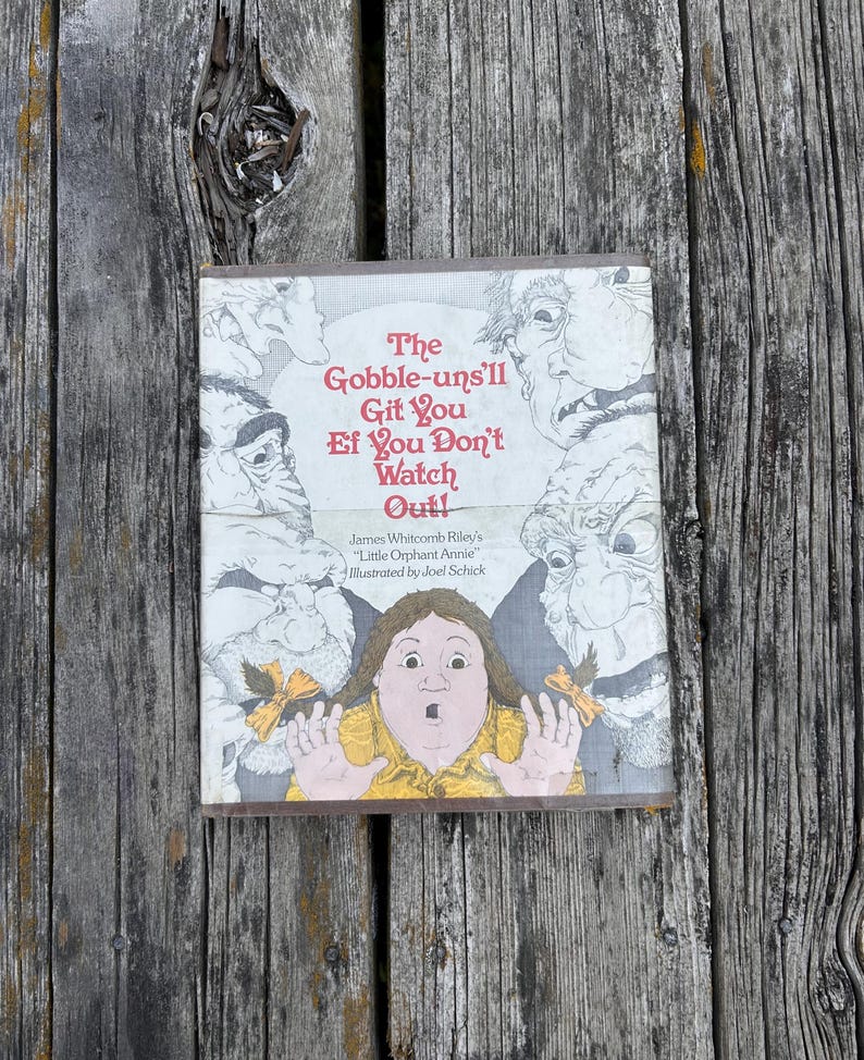 May include: A hardcover book titled The Gobble-uns'll Git You Ef You Don't Watch Out! by James Whitcomb Riley, illustrated by Joel Schick. The cover features a central illustration of a child with hands raised, surrounded by four large, grotesque, grey-toned monster faces.
