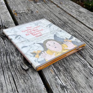 May include: A hardcover children's book titled The Gobble-uns'll Git You Ef You Don't Watch Out! by James Whitcomb Riley, illustrated by Joel Schick, featuring a colorful cover illustration of a wide-eyed child surrounded by whimsical creatures.