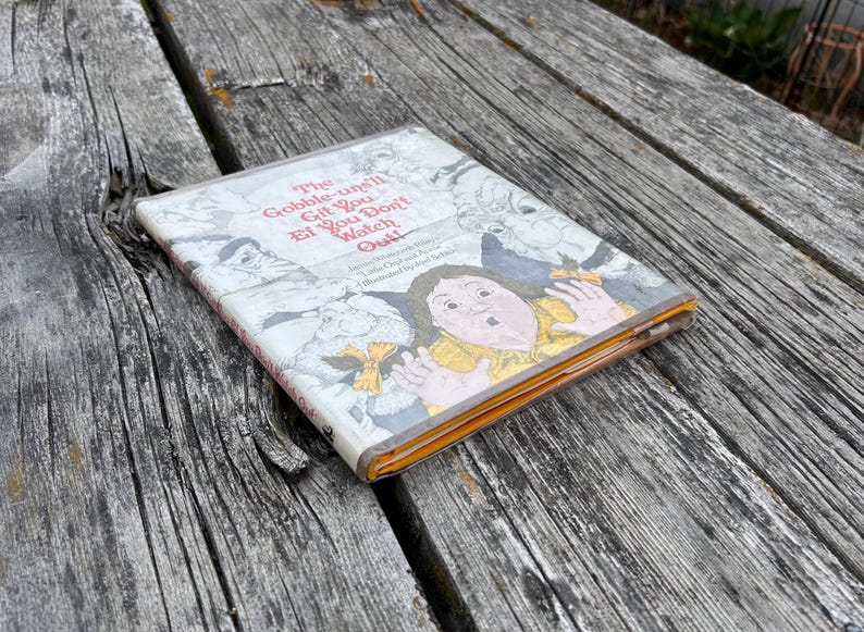 May include: A hardcover children's book titled The Gobble-uns'll Git You Ef You Don't Watch Out! by James Whitcomb Riley, illustrated by Joel Schick, featuring a colorful cover illustration of a wide-eyed child surrounded by whimsical creatures.
