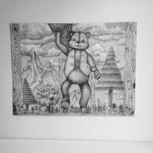 May include: A black and white graphite drawing on paper depicting a bear wearing a vest, hanging from a tree branch. The background features a detailed landscape with mountains, evergreen trees, and clouds, all framed by two vertical wooden logs.
