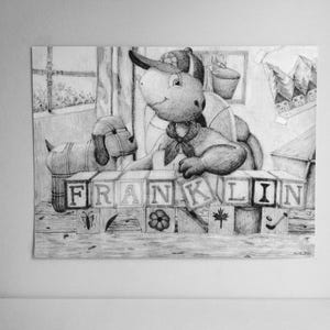 May include: A black and white pencil drawing of a turtle character wearing a baseball cap, positioned behind a row of wooden alphabet blocks that spell out the name FRANKLIN. A small toy dog sits to the left, with various sketches in the background.