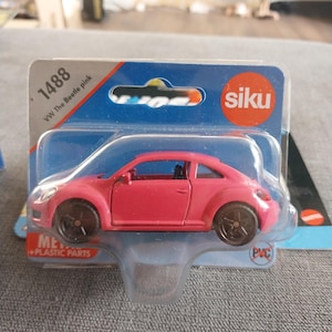 Hotwheels Premium Siku Pink Volkswagen Beatle with rubber tired and opening doors rare and beautiful gift for anyone who loves VW Bugs