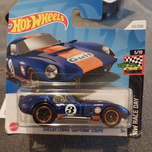 Hotwheels HW Race Day Blue And Orange Gulf Shelby Cobra Daytona Coupe card Rare to find in beautiful condition  lovely gift for all ages
