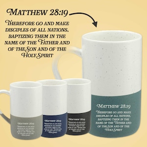 May include: Four ceramic mugs with speckled white upper sections and solid coloured lower bases in teal, grey, navy, and black. Each mug features the text Matthew 28:19: Therefore go and make disciples of all nations, baptizing them in the name of the Father and of the Son and of the Holy Spirit.
