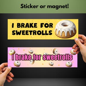 May include: Two yellow and pink rectangular stickers with the text "I brake for Sweetrolls" and a white frosted bundt cake. The stickers are held by hands.
