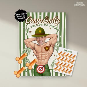 May include: A novelty poster with a cartoon illustration of a muscular man in a park ranger hat. The poster includes the text "Camp Emily" and "Pin the Log on Johnny". A sheet of "The Logs" stickers is also included.