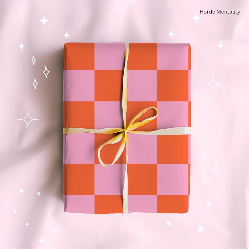 May include: A present wrapped in pink and orange chequered paper, tied with a cream ribbon. The gift is rectangular. The text "Horde Mentality" is visible in the top right corner.